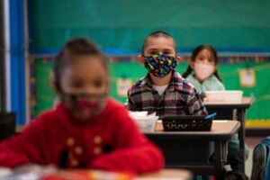 Students sitting in Class Wearing Masks